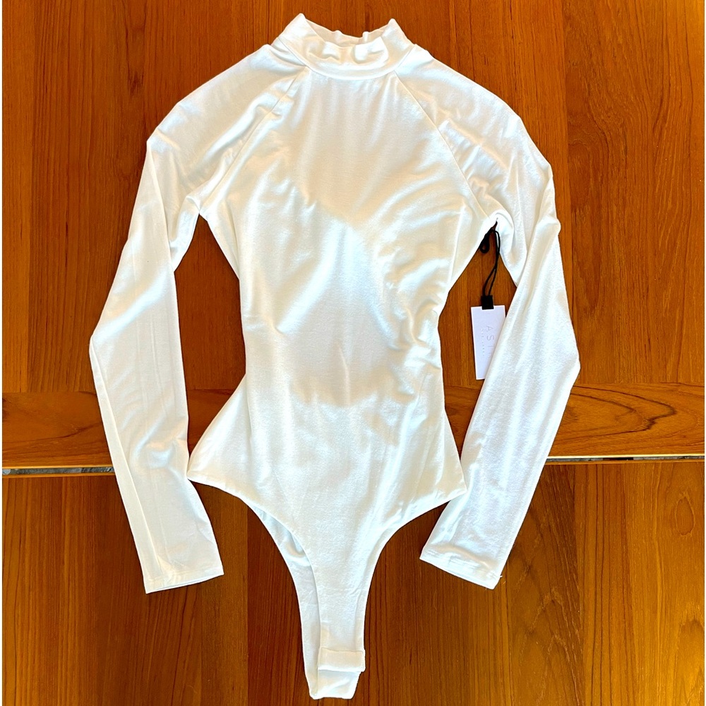 New w/tags leotard from ASTR the limited size S w/cutout detail in the back.